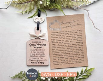 May include: A wooden cutting board ornament with a recipe for a special grandma. The recipe includes ingredients like love, patience, generosity, hugs, kisses, and fun. The ornament is a light brown color with black text.