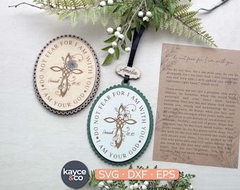 May include: Wooden cross-shaped ornaments with floral accents and the text "I do not fear for I am with you." One is oval with a scalloped edge, the other is round. A card with text and a small wooden tag are also visible.
