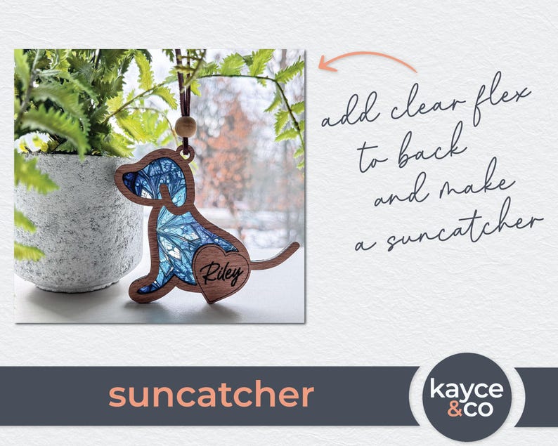May include: A blue and white stained glass dog suncatcher with the name "Riley" on a heart-shaped tag. The suncatcher is hanging from a brown cord.