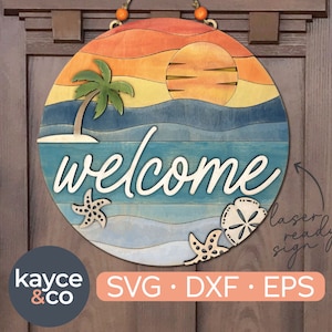 May include: A round wooden welcome sign with a beach theme. The sign features a sunset, palm tree, ocean waves, and seashells. The word "welcome" is written in a cursive font. The sign is laser ready and comes in SVG, DXF, and EPS formats.