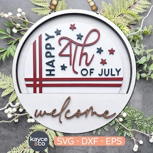 May include: A white wooden round sign with red, white, and blue accents. The sign says "Happy 4th of July" and "Welcome".