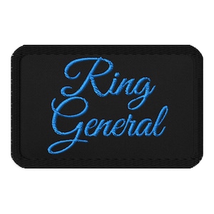 May include: Black embroidered patch with blue lettering that reads "Ring General".