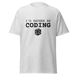 May include: A gray t-shirt with the text "I'd rather be coding" and a black and white icon of a cube with the letter "C" inside.