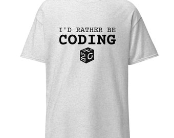 Può includere: Una maglietta grigia con il testo "I'd rather be coding" e un'icona in bianco e nero di un cubo con la lettera "C" all'interno.