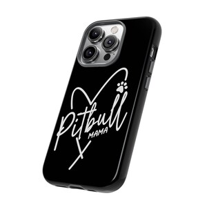 May include: Black phone case with a white heart and paw print design. The text "Pitbull Mama" is written inside the heart.