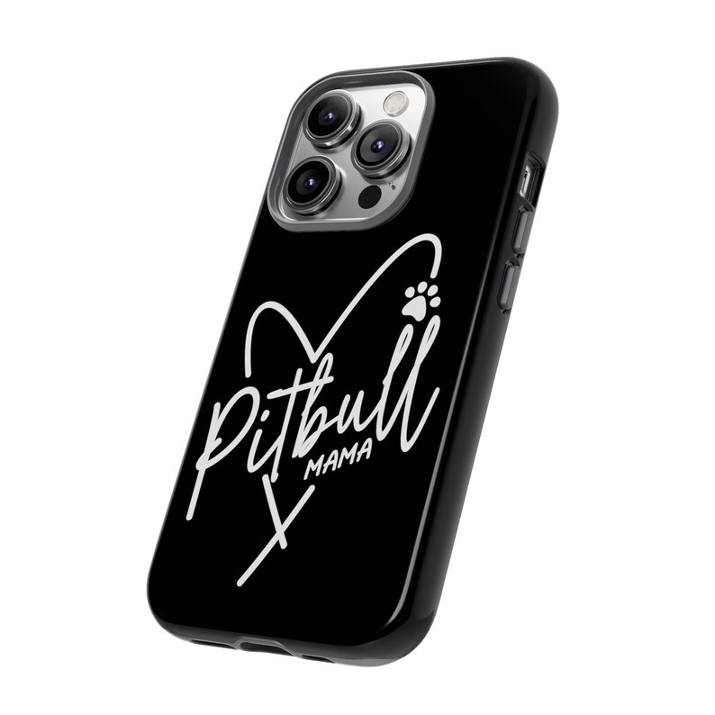 May include: Black phone case with a white heart and paw print design. The text "Pitbull Mama" is written inside the heart.