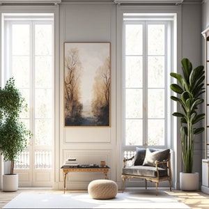 May include: A living room interior with two large windows, a bookshelf, a painting of a forest, a chair, a coffee table, and two potted plants.