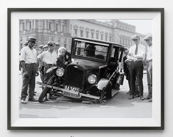 May include: Black and white framed print of a vintage car with several people standing around it. The car has a license plate that reads "84-342 DC". The image is from L'amour Art Studio.