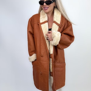 Cappotto in montone e shearling color cognac vintage, giacca invernale in pelle foderata in lana, da uomo e da donna immagine 1