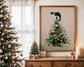 May include: A framed painting shows a Christmas tree with decorations and a black and white cat on top. The painting is on a wooden dresser, with a lit candle, a small Christmas tree, and a decorated Christmas tree nearby.