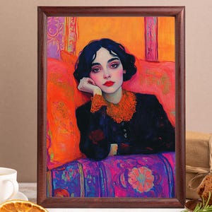 May include: A framed art print featuring a portrait of a woman with dark hair and red lipstick. She is wearing a black dress with an orange collar, set against a vibrant orange and pink background. The artwork is in a wooden frame.