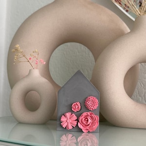 Sweet concrete decorative house made of Raysin, color gray with pink flowers, decoration to put up