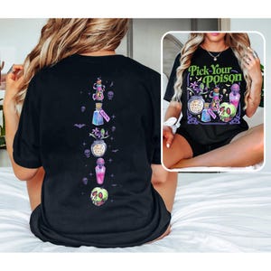 May include: Black t-shirt with a colorful "Pick Your Poison" design featuring potion bottles, a skull, and the text "Deadly Nightshade." The back of the shirt has a vertical arrangement of potion bottles and a skull.