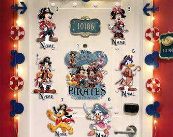 May include: A white door decorated with Disney pirate-themed cutouts. The door features Mickey Mouse, Minnie Mouse, Goofy, Donald Duck, Daisy Duck, and Pluto in pirate attire. Decorative anchors, life preservers, and Mickey Mouse silhouettes are also present.