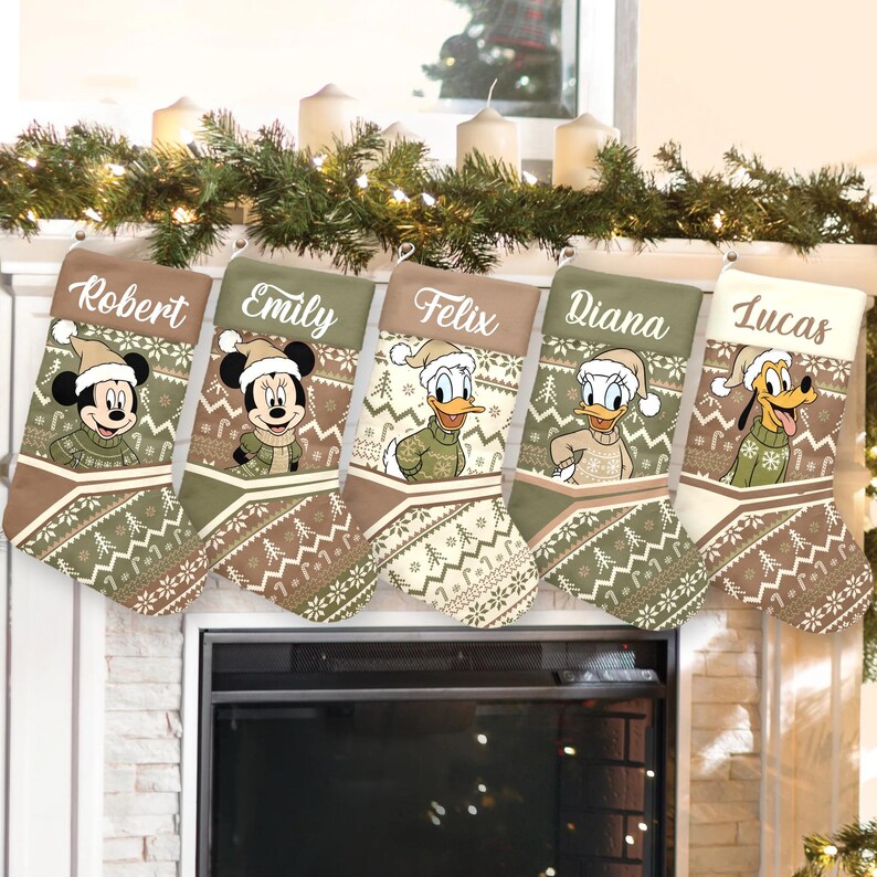 May include: Five Christmas stockings with Disney characters, including Mickey Mouse, Minnie Mouse, Donald Duck, and Pluto. Each stocking has a personalized name and a festive design with a winter theme. The stockings are displayed above a fireplace.