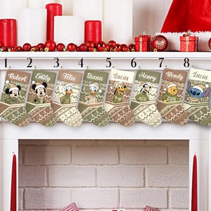 May include: Eight Christmas stockings with Disney character designs, each personalized with a name. The stockings feature characters like Mickey Mouse, Donald Duck, and Winnie the Pooh, with a festive pattern in shades of green, brown, and cream.