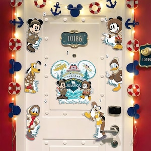 May include: A white door decorated with Disney-themed cutouts, including Mickey and Minnie Mouse, Pluto, Donald Duck, and Goofy. The door also features anchor and life preserver decorations, along with a sign that reads "10186".