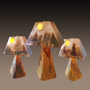 Combination shot of small and medium Hickory log bases with copper shades.  Great for Cabin Lighting