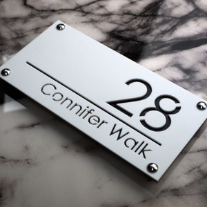 House Wall Plaques UK | Luxe A4 | Door Number Laser Cut House Acrylic Address Plaques | Matt White & Black Marble | 280mm x 140mm