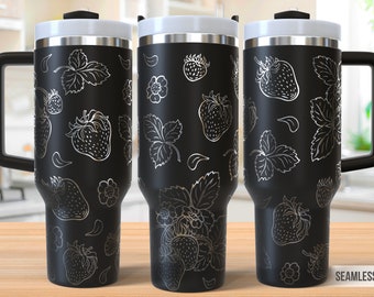 May include: Three black stainless steel travel mugs with a white design of strawberries and leaves. The mugs have a handle and a lid. The text "SEAMLESS DESIGN" is visible at the bottom right corner of the image.