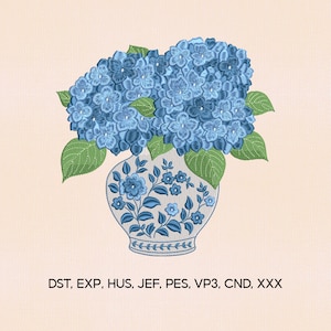 May include: A digital embroidery design featuring a blue hydrangea bouquet in a decorative vase. The vase is adorned with blue floral patterns. Green leaves surround the flowers. The image includes the text: DST, EXP, HUS, JEF, PES, VP3, CND, XXX.