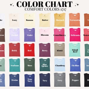 May include: A colour chart of Comfort Colours 1717 t-shirts, displaying a range of hues. The chart includes colours like white, ivory, banana, butter, mustard, terracotta, and yam. Other colours include espresso, orchid, violet, blossom, and crunchberry.