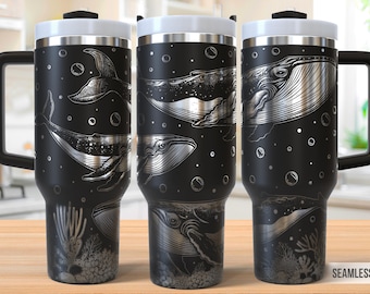 May include: Three black stainless steel travel mugs with a silver whale design. The mugs have a black background with silver whales, bubbles, and coral.
