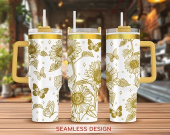 Op de afbeelding: Een witte tumbler met een gouden deksel en handvat. De tumbler heeft een naadloos ontwerp van gouden vlinders en zonnebloemen. De tekst "SEAMLESS DESIGN" is onder de tumbler gedrukt.
