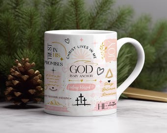 May include: White ceramic mug with a pink and gold design. The mug features various inspirational quotes and phrases, including "Trust in His Promises", "God is My Anchor", "Feeling Blessed", and "Pray Believe Receive".