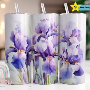 May include: Three stainless steel tumblers with a watercolor design of purple iris flowers. The tumblers are white and have a straw in each.