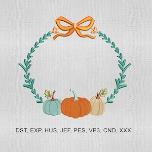 May include: An embroidered design featuring a circular wreath of green leaves, an orange bow, and three pumpkins in teal, orange, and tan. The text "DST, EXP, HUS, JEF, PES, VP3, CND, XXX" is at the bottom.
