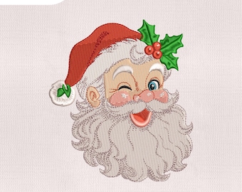 Puede incluir: Bordado de la cara de Papá Noel con un guiño, gorro rojo y barba blanca. El diseño incluye acebo y bayas. Tamaños disponibles: 10.16 cm, 12.7 cm, 15.24 cm y 17.78 cm.