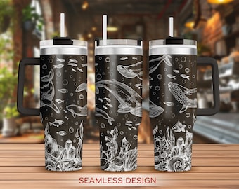 May include: A black and white stainless steel tumbler with a whale and fish design. The tumbler has a black lid and a black handle. The text "Seamless Design" is printed below the tumbler.