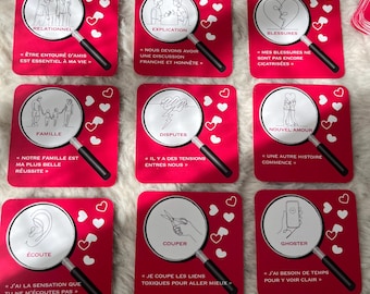 May include: Nine red square cards with white illustrations and text, featuring relationship themes. Each card has a magnifying glass design and white heart accents. The cards include phrases like "Family" and "New Love".