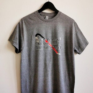 May include: Gray t-shirt with a red and black wrench graphic and the text "there's no issue cannot be solved with simple tool".