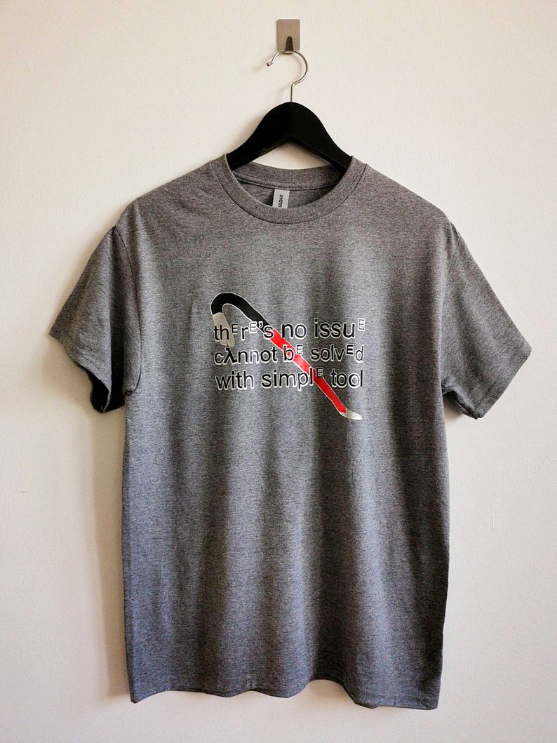 May include: Gray t-shirt with a red and black wrench graphic and the text "there's no issue cannot be solved with simple tool".