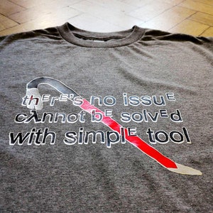 May include: Gray t-shirt with a red and white crowbar graphic and the text "There's no issue cannot be solved with simple tool".