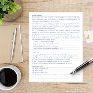 May include: A workspace scene featuring a meeting summary document, a notepad, a pen, a coffee cup, and small potted plants. The document details project updates. The pen is silver and black. The notepad is spiral-bound.