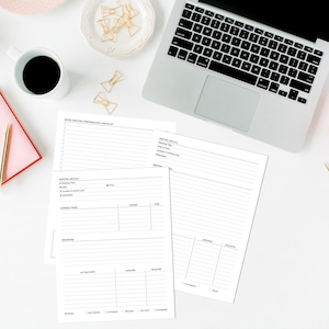 May include: A workspace scene with a laptop, pink notebook, and coffee cup. Meeting preparation checklists and notepaper are scattered on the white surface. Gold-colored pens and paperclips add accents. A pink teapot and candle complete the setup.