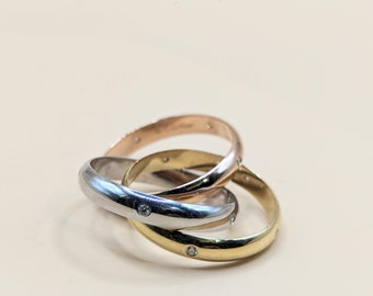 CARTIER Trinity wedding ring in gold and diamonds