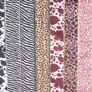 Peut inclure: Une collection de rubans &agrave; motifs vari&eacute;s, notamment des imprim&eacute;s animaliers comme le z&egrave;bre, le l&eacute;opard et la peau de vache. D'autres motifs incluent un motif rose et blanc &agrave; pois et un motif c&oelig;ur rose et jaune. Les rubans ont des bords festonn&eacute;s.