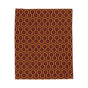 May include: A repeating pattern of red and orange hexagons. The pattern is reminiscent of the carpet in the Overlook Hotel from the movie "The Shining".