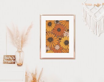May include: A framed print of a vintage floral pattern featuring orange, yellow, and brown flowers. The flowers are arranged in a dense, repeating pattern.