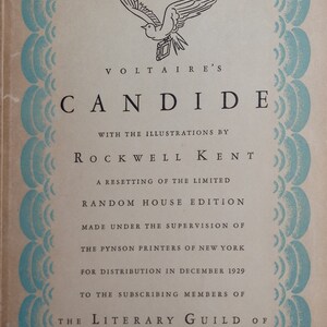 May include: A vintage book cover with a blue and white border design. The title "VOLTAIRE'S CANDIDE" is printed in black text. The book is a limited edition, illustrated by Rockwell Kent and published by Random House.