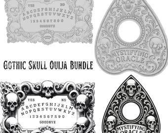 May include: A Gothic-themed Ouija board bundle featuring two boards and two planchette pointers. The boards have skull and floral designs, with the alphabet, numbers, and the words "Yes," "No," and "Goodbye." The planchette pointers have a circular opening.