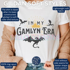 May include: White t-shirt with a black dragon graphic and the text "In My Gamlyn Era". The shirt is made of a lightweight soft fabric and is 100% ring-spun cotton.