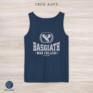 May include: A navy blue tank top with a white graphic design featuring a dragon and the text "Basgiath War College, Navarre, Riders Quadrant".