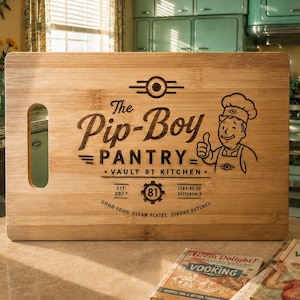 May include: A wooden chopping board with the text "The Pip-Boy Pantry" and a chef illustration. The board has a handle and is set on a table with vintage cookbooks. The kitchen setting features retro appliances and decor.