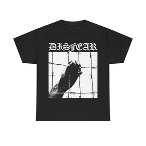 May include: Black t-shirt with the word "DISFEAR" in a gothic font above a black and white image of a hand reaching through barbed wire. The shirt is made of a soft, comfortable material.