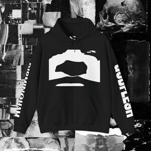 May include: Black hoodie with a large white graphic on the front. The graphic is a stylized shape with a dark center. The word "BIRMINGHAM" is printed vertically on the left sleeve, and "COUTLEON" on the right sleeve.